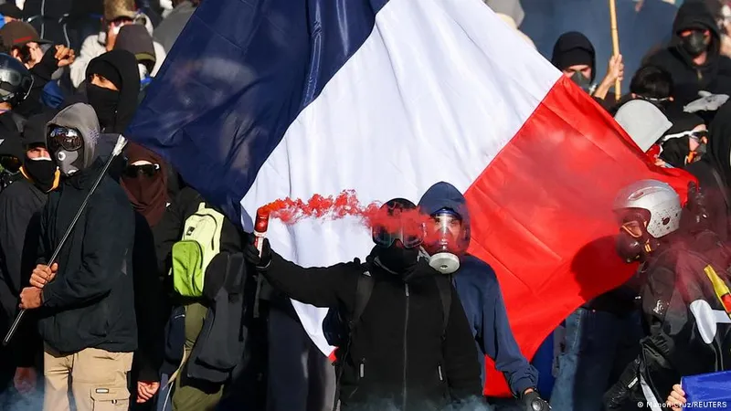 Situation turns tense in Paris and Marseille as government estimates 410,000 to have taken part in protests across France.
